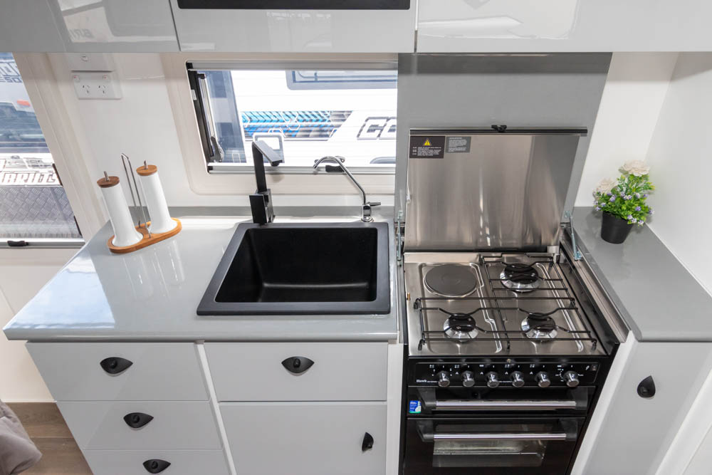 Kitchen facilities in the Ultimate Family Twin Bunk Caravan
