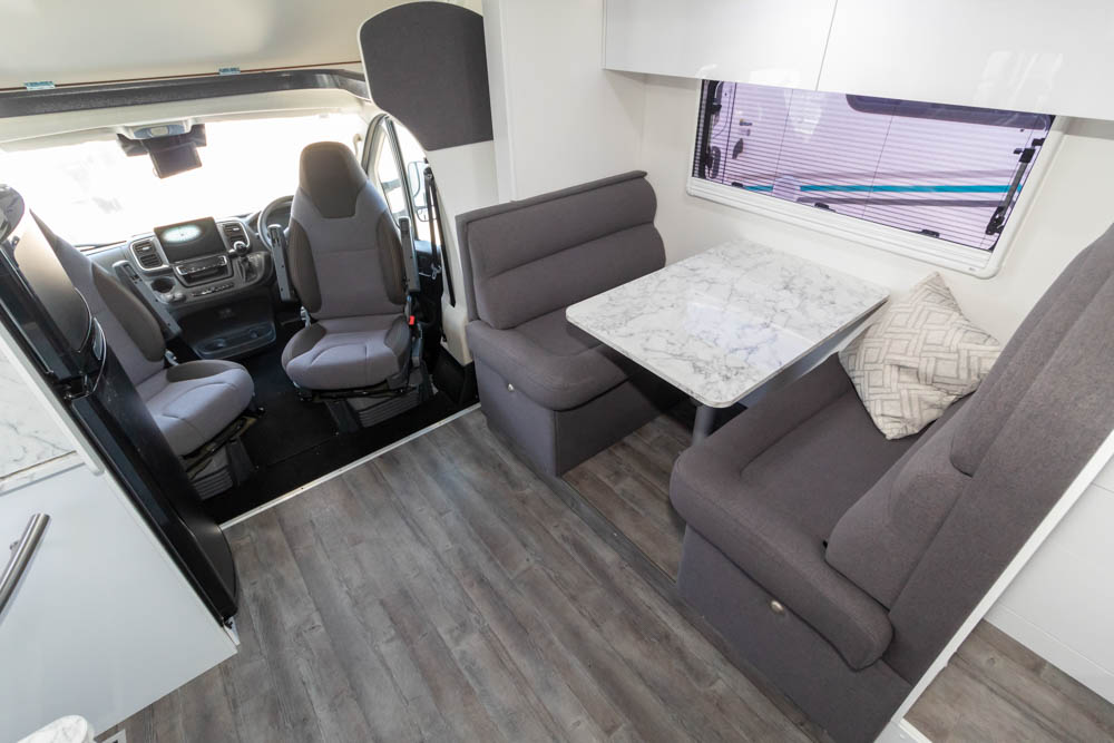 dinette and swivel seats in the Avida Birdsville 7454SL motorhome