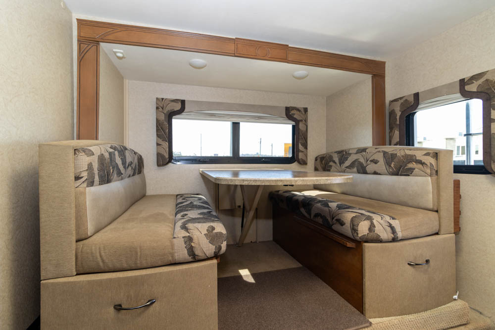 Dinette on the slide-out in the Lance 855S Slide-On Camper
